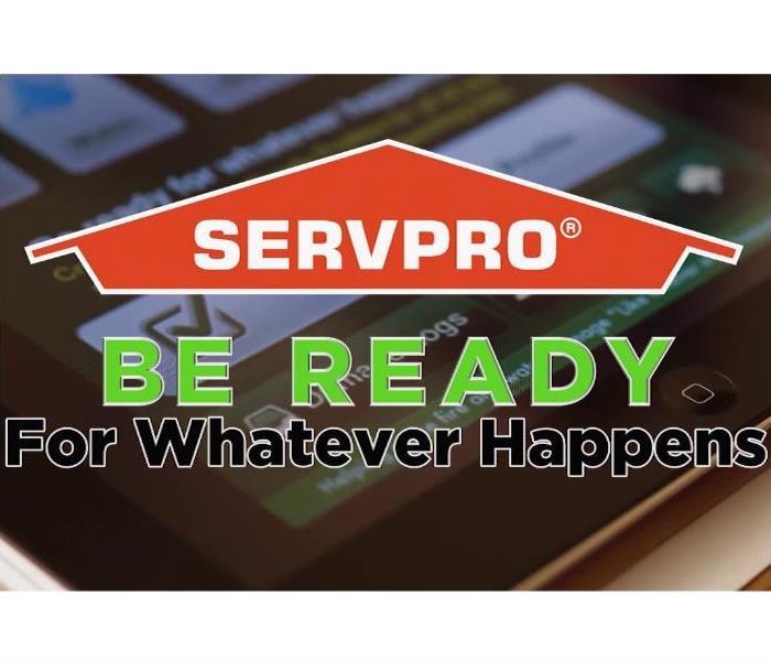Blurred iPad background, orange SERVPRO house with "Be ready for whatever happens" under the house.